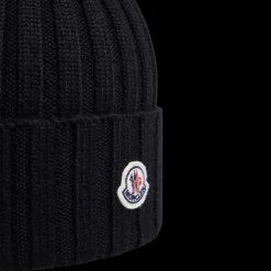 Bonnet MONCLER laine mérinos noir pompon