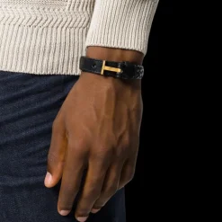 Bracelet TOM FORD cuir tressé noir attache T doré