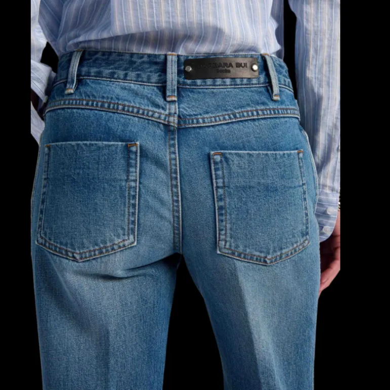 Jean flare BARBARA BUI 5 poches coton denim bleu rivets métal argent