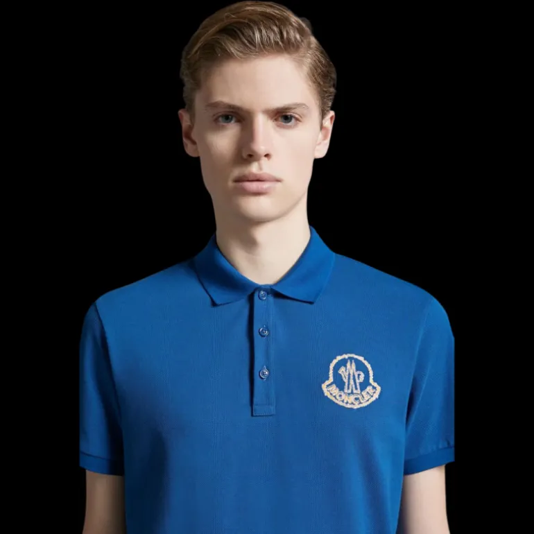 Polo coton piqué MONCLER bleu broderie logo orange