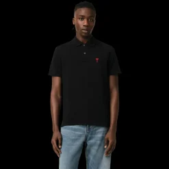 Polo manche courte AMI Paris piqué coton noir broderie cœur rouge