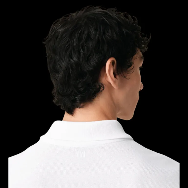 Polo manche courte AMI Paris piqué coton blanc broderie cœur rouge