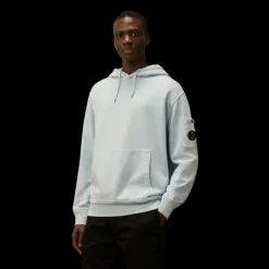 Sweat-shirt à capuche CP COMPANY coton brossé diagonal bleu ciel poche lentille