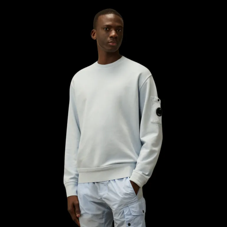 Sweat-shirt CP COMPANY col rond coton brossé diagonal bleu ciel poche lentille