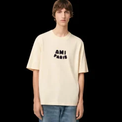 T-shirt AMI Paris col rond jersey de coton bio écru Patch ami maille bleu marine