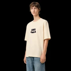 T-shirt AMI Paris col rond jersey de coton bio écru Patch ami maille bleu marine