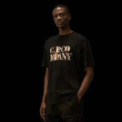 T-shirt CP COMPANY col rond jersey coton noir logo flou orange